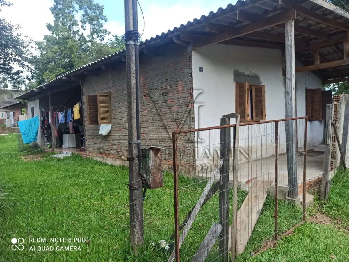 LOTE 000 - Um Terreno Urbano, onde possui uma Casa de Alvenaria com aproximadamente 51,62 metros quadrados