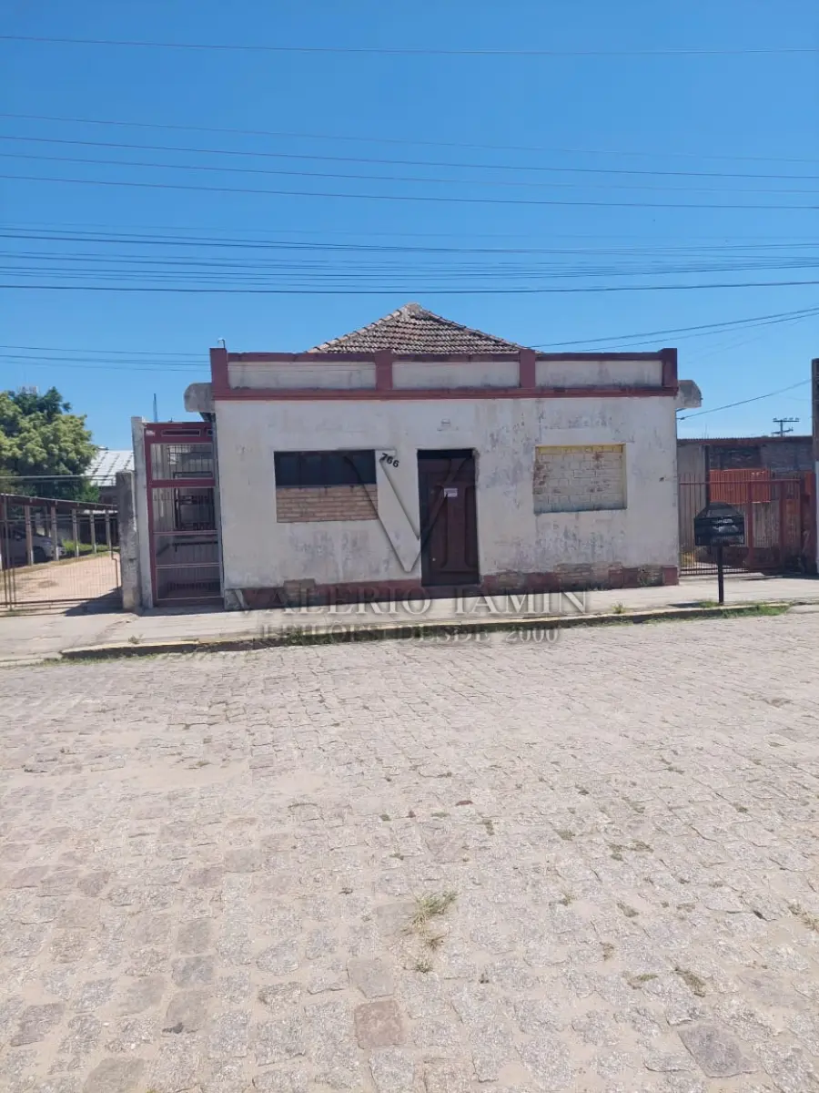 LOTE 456 - TERRENO com área superficial de 395,78m², situado na zona urbana desta cidade de Tapes/RS