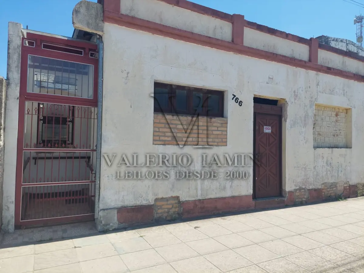 LOTE 456 - TERRENO com área superficial de 395,78m², situado na zona urbana desta cidade de Tapes/RS