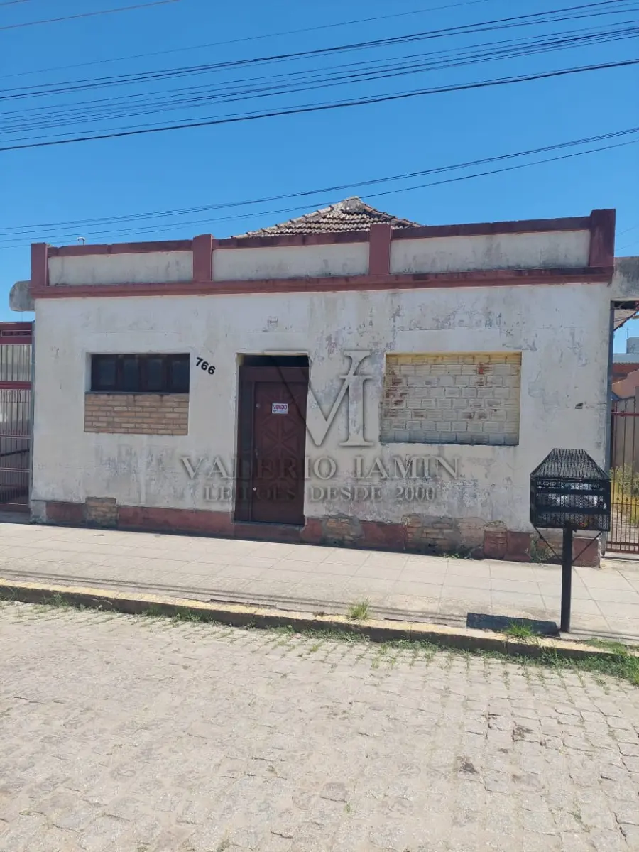 LOTE 456 - TERRENO com área superficial de 395,78m², situado na zona urbana desta cidade de Tapes/RS