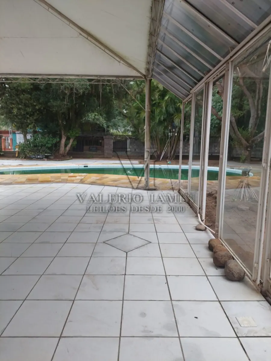 LOTE 515 - IMÓVEL – Sobrado em alvenaria localizado na Av. Guaíba nº1646 emPorto Alegre