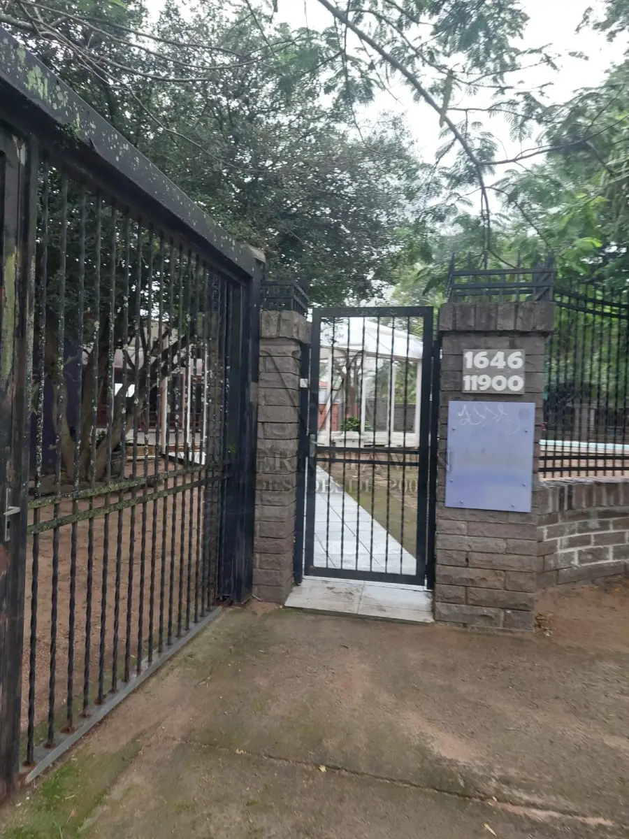 LOTE 515 - IMÓVEL – Sobrado em alvenaria localizado na Av. Guaíba nº1646 emPorto Alegre