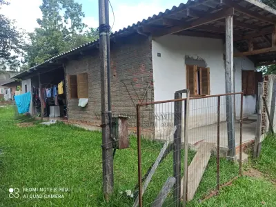 LOTE 000 - Um Terreno Urbano, onde possui uma Casa de Alvenaria com aproximadamente 51,62 metros quadrados