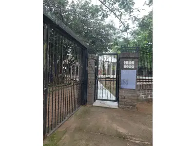 LOTE 515 - IMÓVEL – Sobrado em alvenaria localizado na Av. Guaíba nº1646 emPorto Alegre