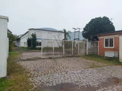LOTE 619 - IMÓVEL: UM TERRENO EM FORMA RETANGULAR, com um prédio em Alvenaria como parte integrante do engenho e depósitos e demais prédios anexos para escritório, garagem e demais benfeitorias, com área construída de aproximadamente de 1.450,06m²