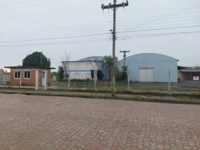 LOTE 619 - IMÓVEL: UM TERRENO EM FORMA RETANGULAR, com um prédio em Alvenaria como parte integrante do engenho e depósitos e demais prédios anexos para escritório, garagem e demais benfeitorias, com área construída de aproximadamente de 1.450,06m²