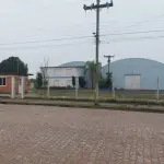 LOTE 619 - IMÓVEL: UM TERRENO EM FORMA RETANGULAR, com um prédio em Alvenaria como parte integrante do engenho e depósitos e demais prédios anexos para escritório, garagem e demais benfeitorias, com área construída de aproximadamente de 1.450,06m²